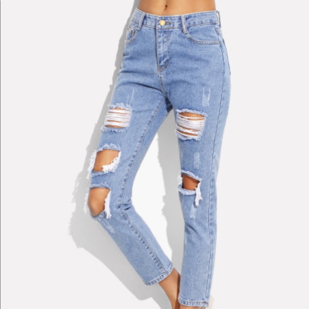 Ripped light wash jeans never worn